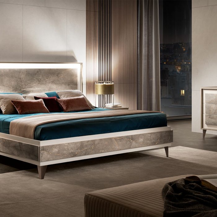 adora interiors ambra bedroom with lights on and dresser